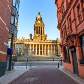 Leeds town hall viewed from the narrow streets.