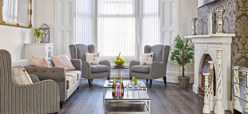 Living room with chairs and a table with champagne!