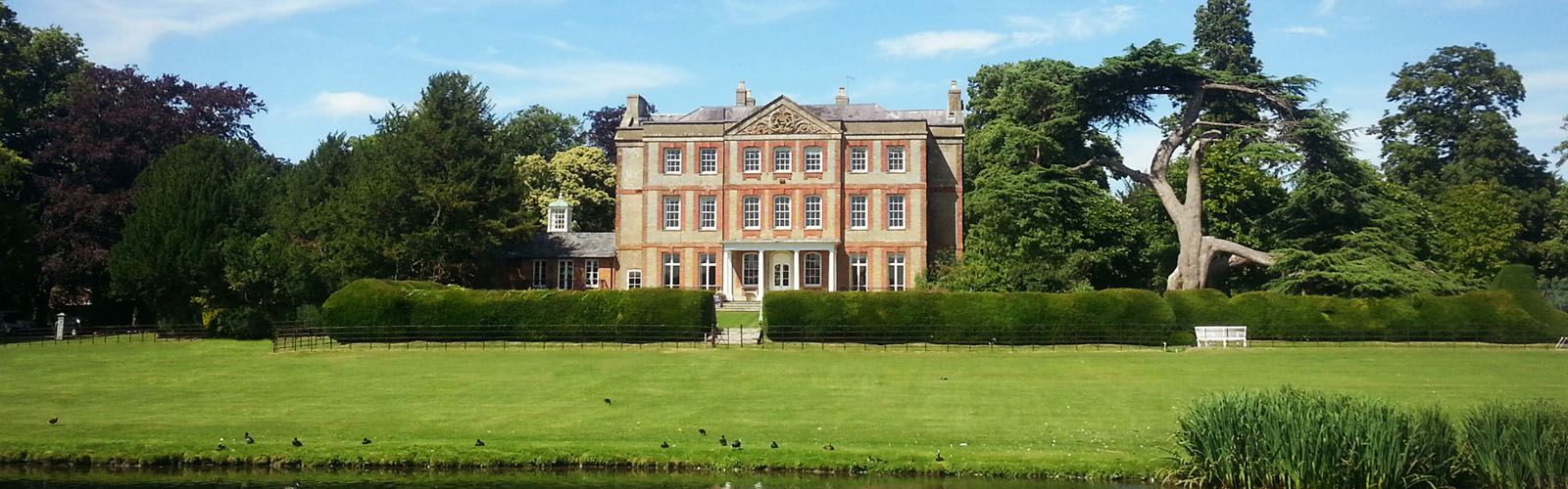 luxury manor house with lake.