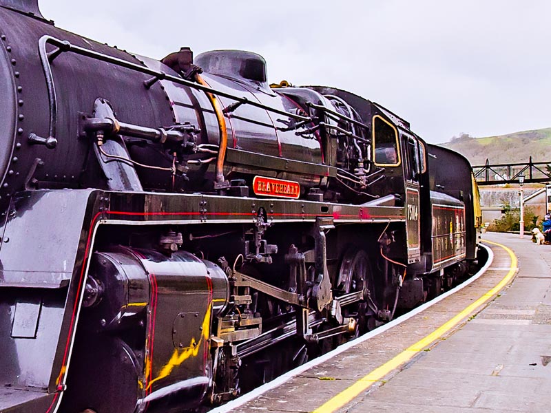 Steam train at a station.