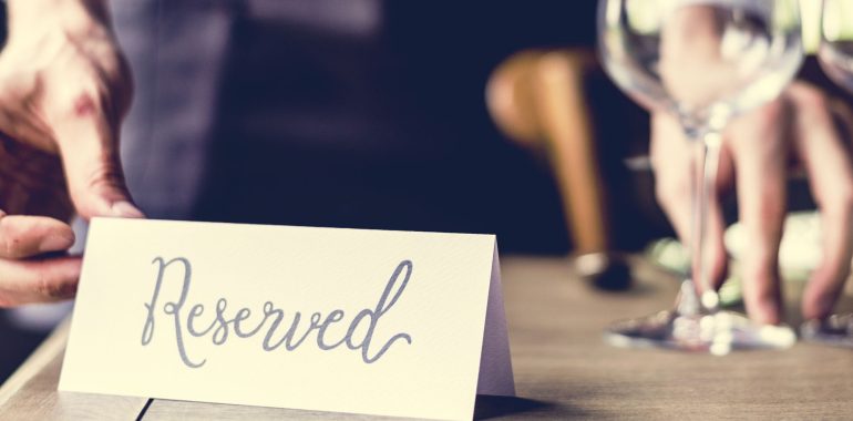 Restaurants table with a reserved notice on it.