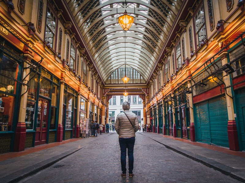 Man walking through Leadenhall Market, London