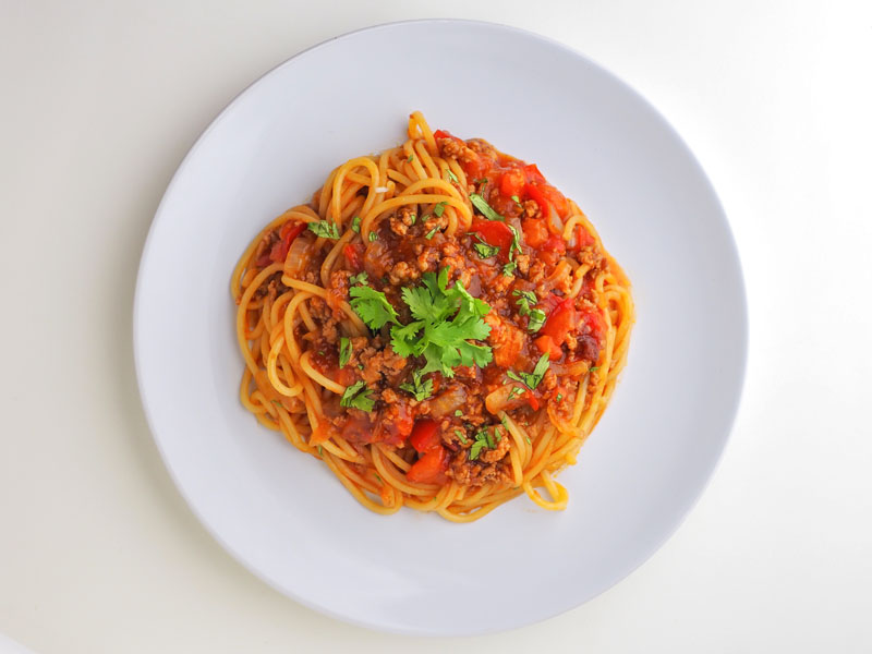 Spaghetti bolognese being served in an italian restaurants.