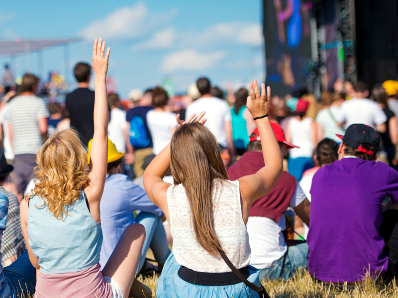 People enjoying music festival.