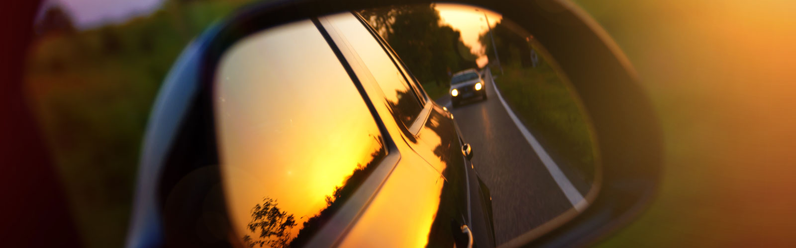 Car rearview mirror, looking back.