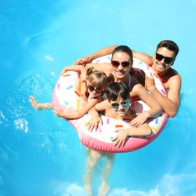 Family in a swimming pool.