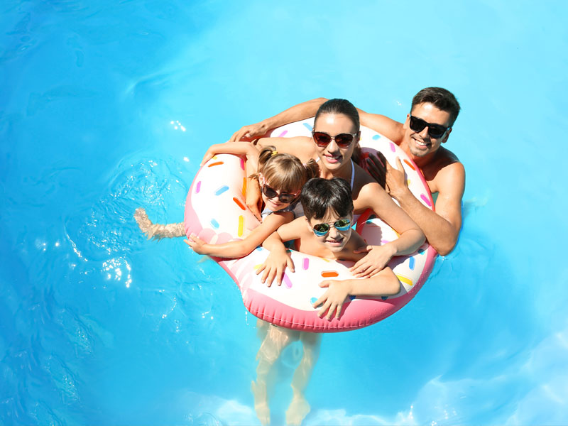 Family in a swimming pool.