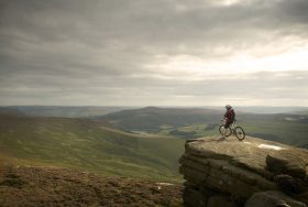 Mountain biker looking over the Peak District.