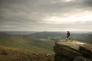 Mountain biker looking over the Peak District.