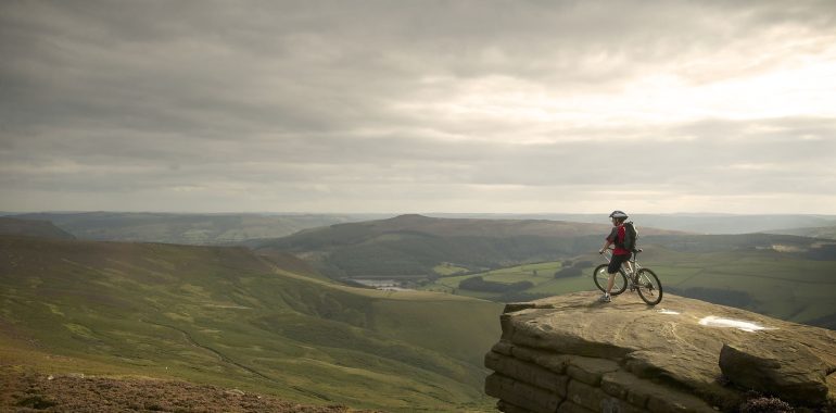 Mountain biker looking over the Peak District.