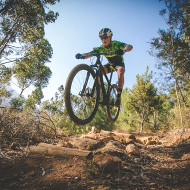 Cyclist jumping on a cycle trail.