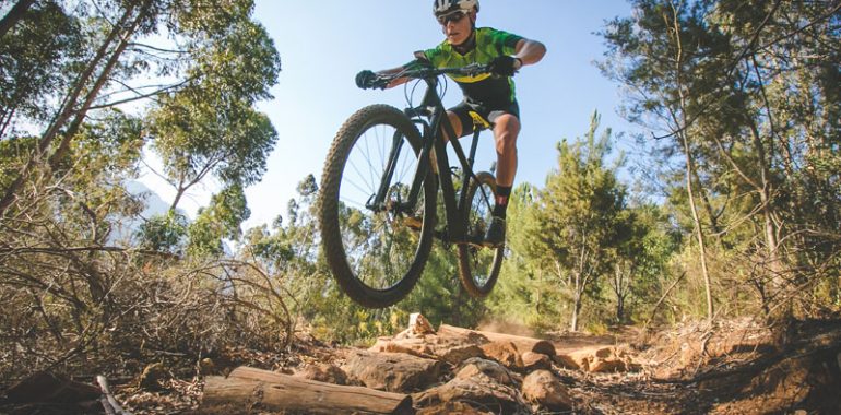 Cyclist jumping on a cycle trail.