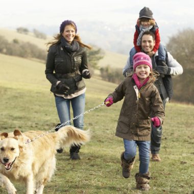 Family walking their dog.