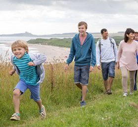 Family enjoying a walk on holiday together.