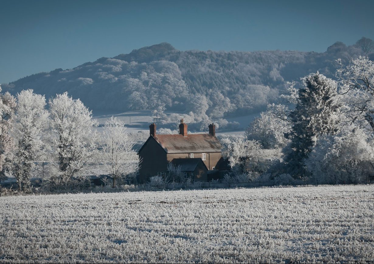 Countryside cottage with snow