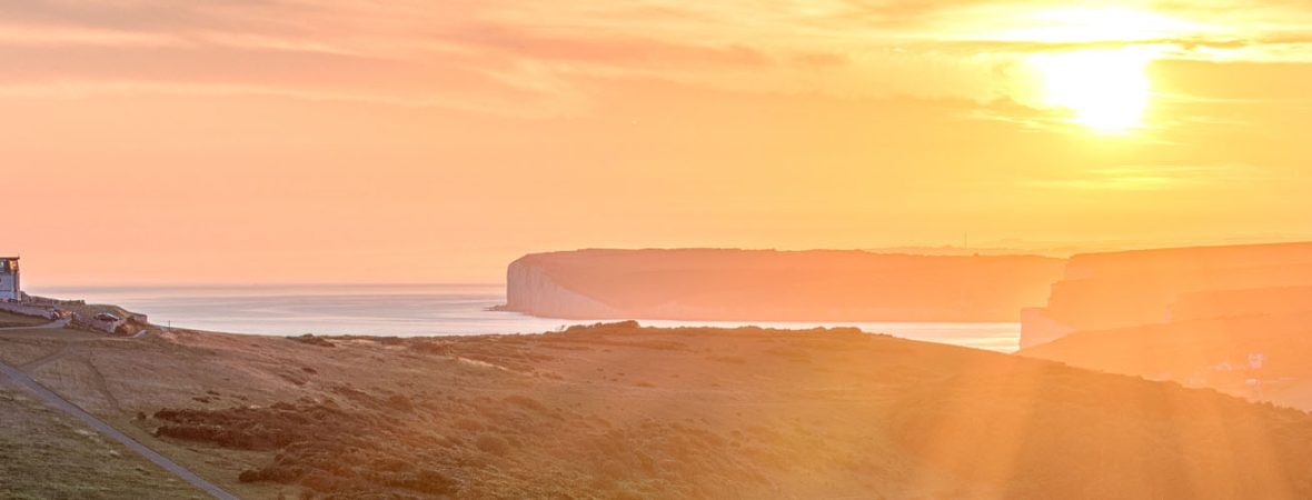 Beautiful lighthouse on the cliffs at sunset in Essex