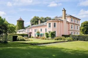 A large holiday cottage with charming pink walls, perfect for large groups celebrating and getting together