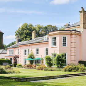 A large holiday cottage with charming pink walls, perfect for large groups celebrating and getting together